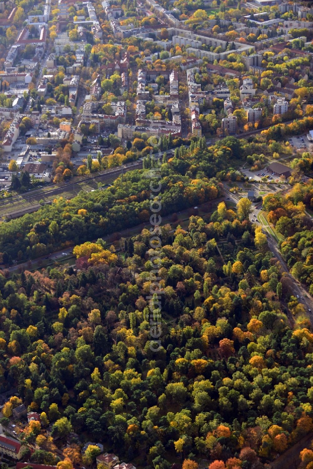 Berlin from above - Overlooking autumn colored treetops at the railway station Schoenholz with a view of residential areas on the border of the districts Pankow and Reinickendorf in Berlin