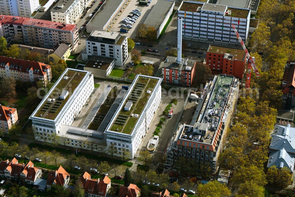 München from above - Autumnal discolored vegetation view construction site for the multi-family residential building Van B on street Infanteriestrasse in the district Schwabing-West in Munich in the state Bavaria, Germany