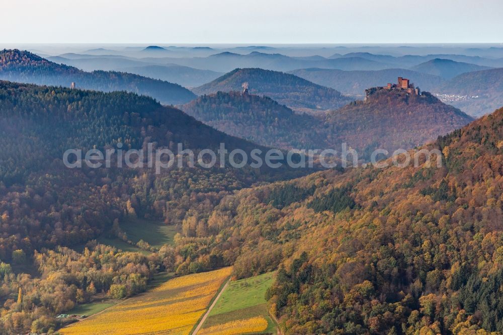 Annweiler am Trifels from above - Autumnal discolored vegetation view of castle of the fortresses Trifels, Scharfeneck and Anebos at sunset in Annweiler am Trifels in the state Rhineland-Palatinate, Germany