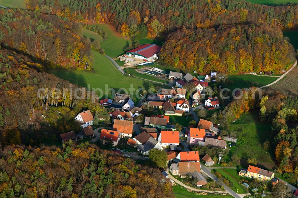 Aerial photograph Grünreuth - Autumnal discolored vegetation view village - view on the edge of forested areas in Gruenreuth in the state Bavaria, Germany