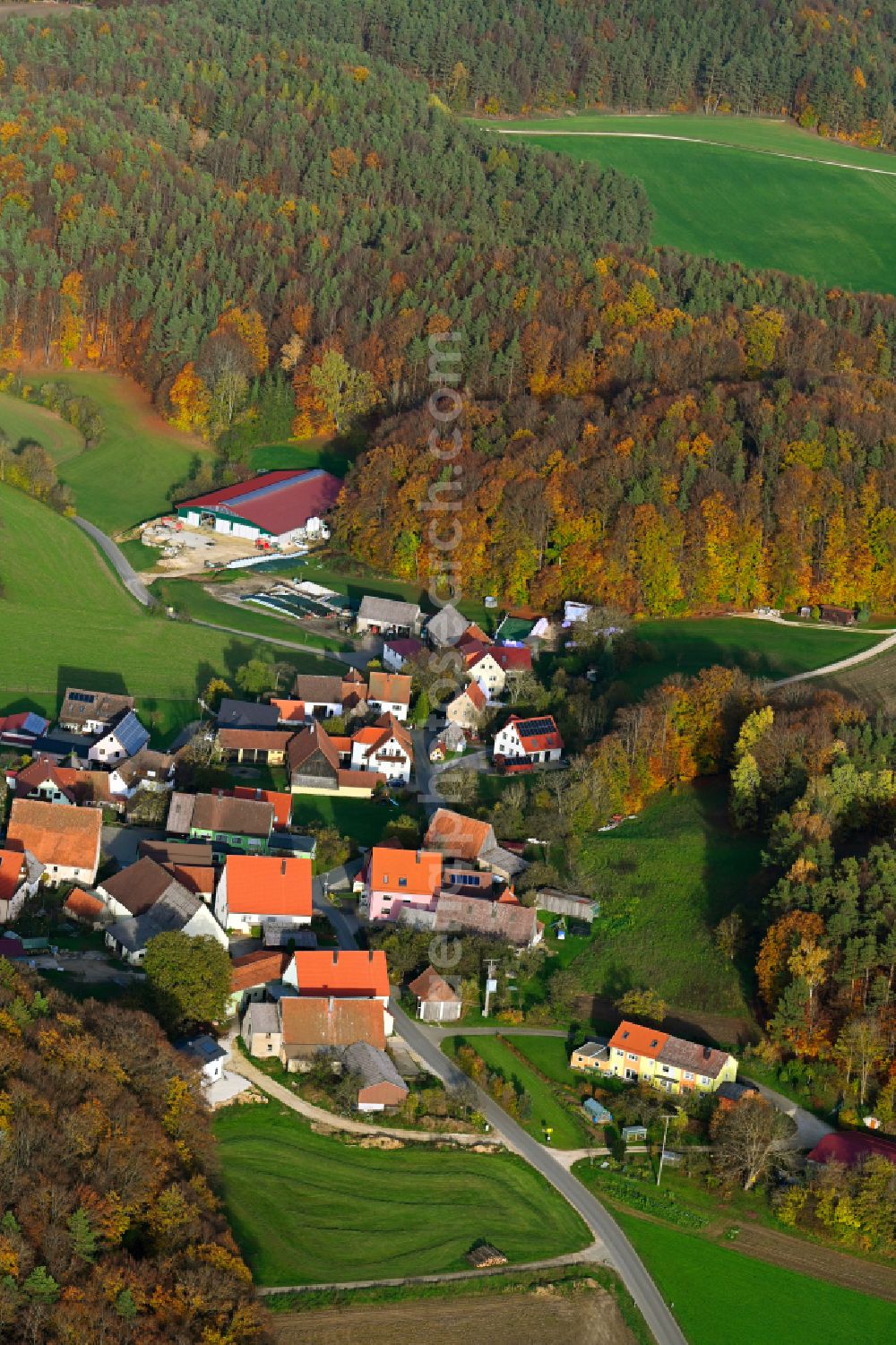 Grünreuth from above - Autumnal discolored vegetation view village - view on the edge of forested areas in Gruenreuth in the state Bavaria, Germany