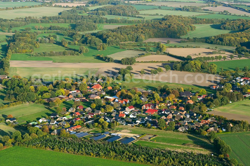 Kasseburg from above - Autumnal discolored vegetation view agricultural land and field boundaries surround the settlement area of the village in Kasseburg in the state Schleswig-Holstein, Germany