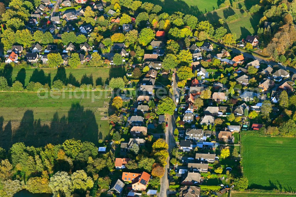 Aerial image Rotenbek - Autumnal discolored vegetation view agricultural land and field boundaries surround the settlement area of the village in Rotenbek in the state Schleswig-Holstein, Germany