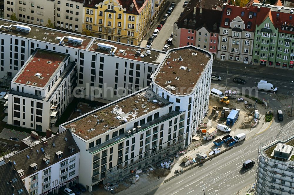 München from the bird's eye view: Autumnal discolored vegetation view construction site for the new residential and commercial Corner house - building PLAZA Pasing on Oberseestrasse corner Bodenseestrasse in the district Pasing-Obermenzing in Munich in the state Bavaria, Germany