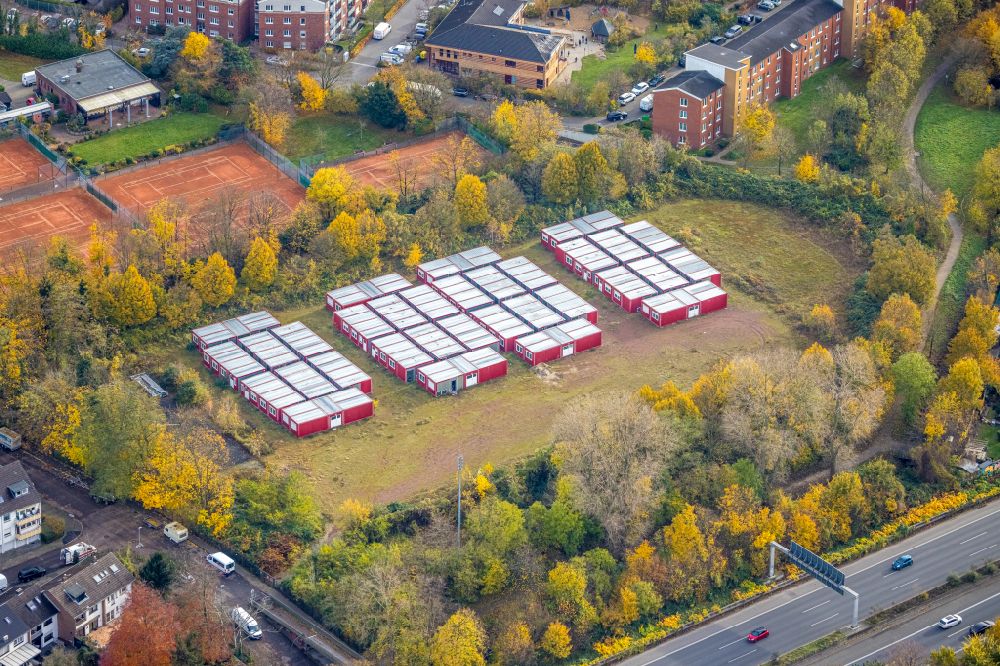 Aerial image Düsseldorf - Autumnal discolored vegetation view container settlement as temporary shelter and reception center for refugees on street Marler Strasse in the district Rath in Duesseldorf at Ruhrgebiet in the state North Rhine-Westphalia, Germany