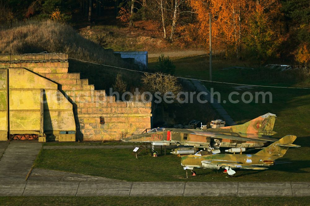 Aerial photograph Finowfurt - Autumnal discolored vegetation view fighter bomber MiG-23BN and fighter plane Mig 15 on the open space in front of the museum and exhibition building ensemble Luftfahrtmuseum Finowfurt on Museumstrasse in Finowfurt in the Schorfheide in the state Brandenburg, Germany