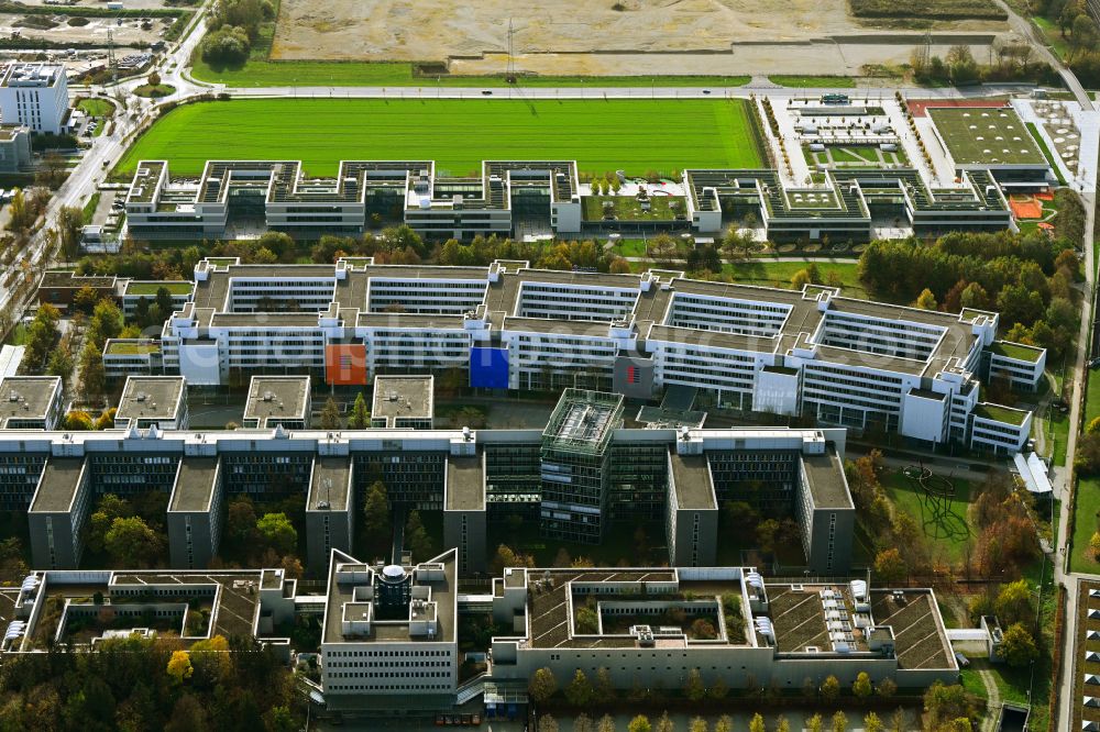 Aerial photograph Unterföhring - Autumnal discolored vegetation view office building - Ensemble of Allianz Deutschland AG on Dieselstrasse in the district Bogenhausen in Unterfoehring in the state Bavaria, Germany