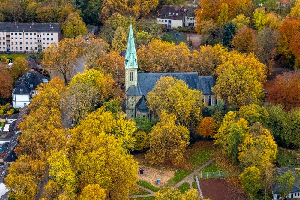 Leithe from the bird's eye view: Autumnal discolored vegetation view church building St. Johannes on street Kemnastrasse in Leithe at Ruhrgebiet in the state North Rhine-Westphalia, Germany