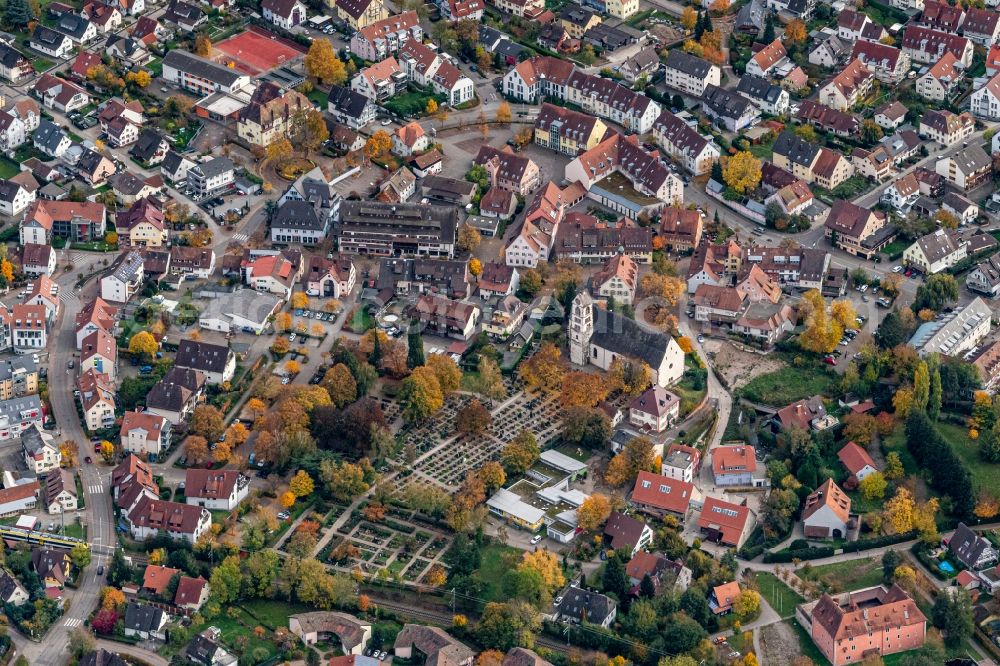 Aerial image Kirchzarten - Autumnal discolored vegetation view church building in the village of in Kirchzarten in the state Baden-Wuerttemberg, Germany