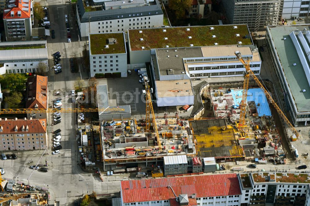 München from the bird's eye view: Autumnal discolored vegetation view construction site to build a new office and commercial building FABRIK office in Munich in the state Bavaria, Germany