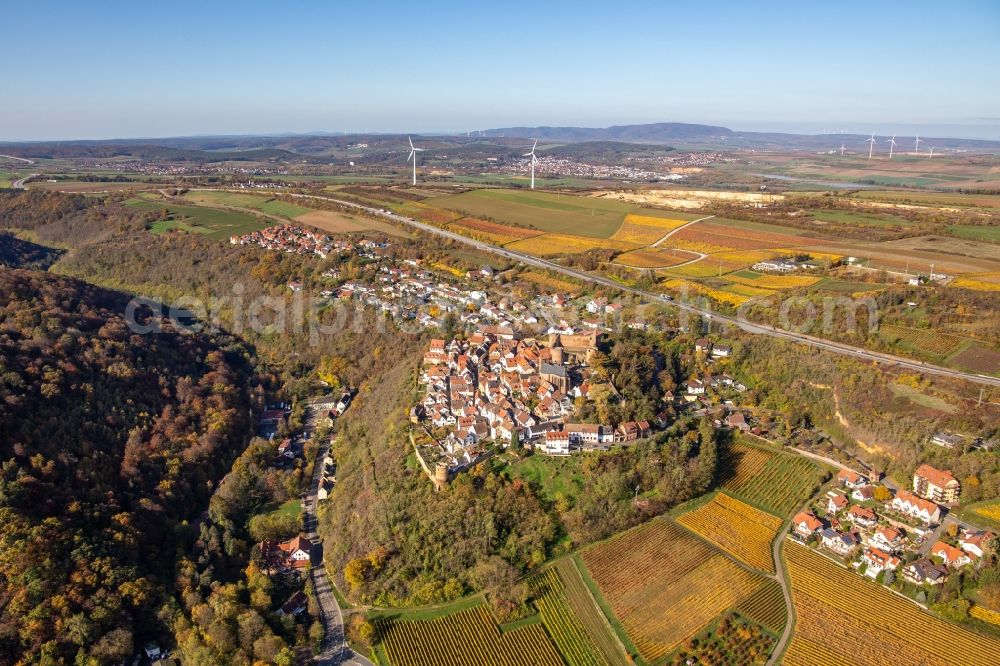 Neuleiningen from above - Autumnal discolored vegetation view town center on the edge of vineyards and wineries in the wine-growing area in Neuleiningen in the state Rhineland-Palatinate, Germany