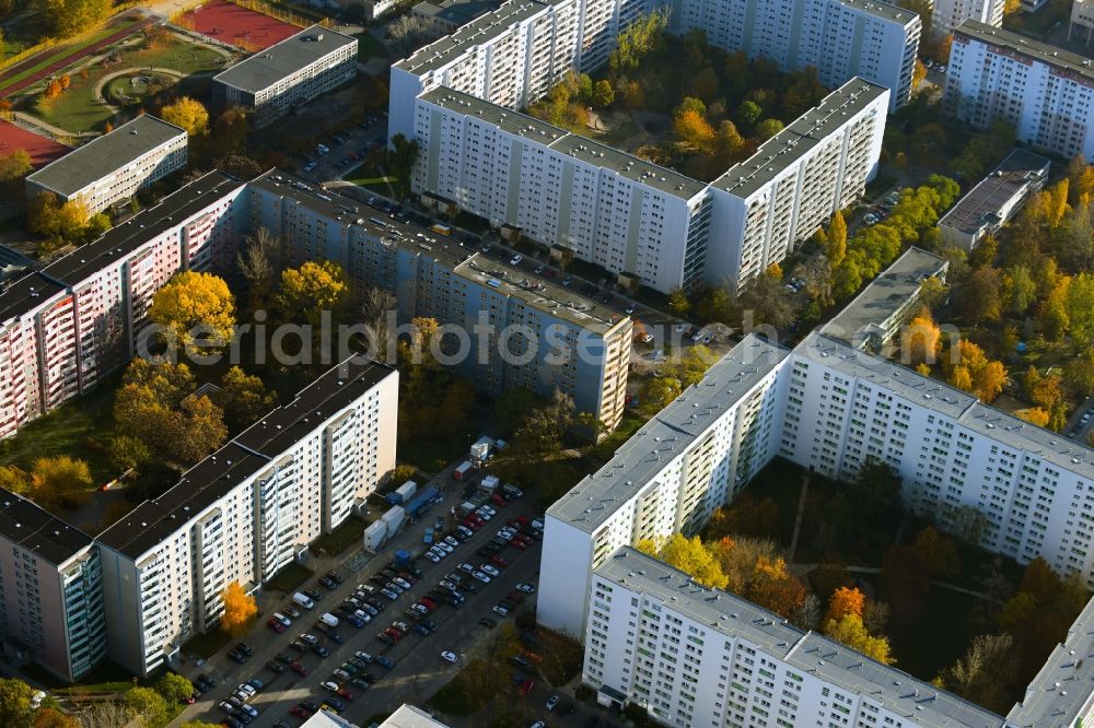Berlin from the bird's eye view: Autumnal discolored vegetation view skyscrapers in the residential area of industrially manufactured settlement on Ahrenshooper Strasse in the district Neu-Hohenschoenhausen in Berlin, Germany