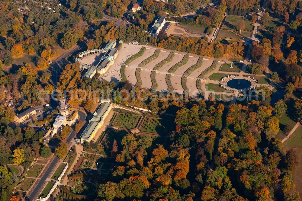Aerial photograph Potsdam - Autumnal discolored vegetation view sanssouci Palace in Potsdam in Brandenburg. The Sanssouci Palace in the eastern part of the park of the same name is one of the most famous castles of Hohenzollern. The palaces and gardens are world heritage and under UNESCO protection