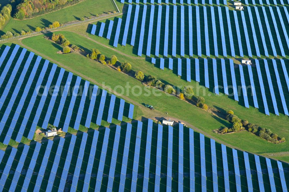 Aerial photograph Lanken - Autumnal discolored vegetation view rows of panels of a solar power plant and photovoltaic system on a field in Lanken in the state Schleswig-Holstein, Germany