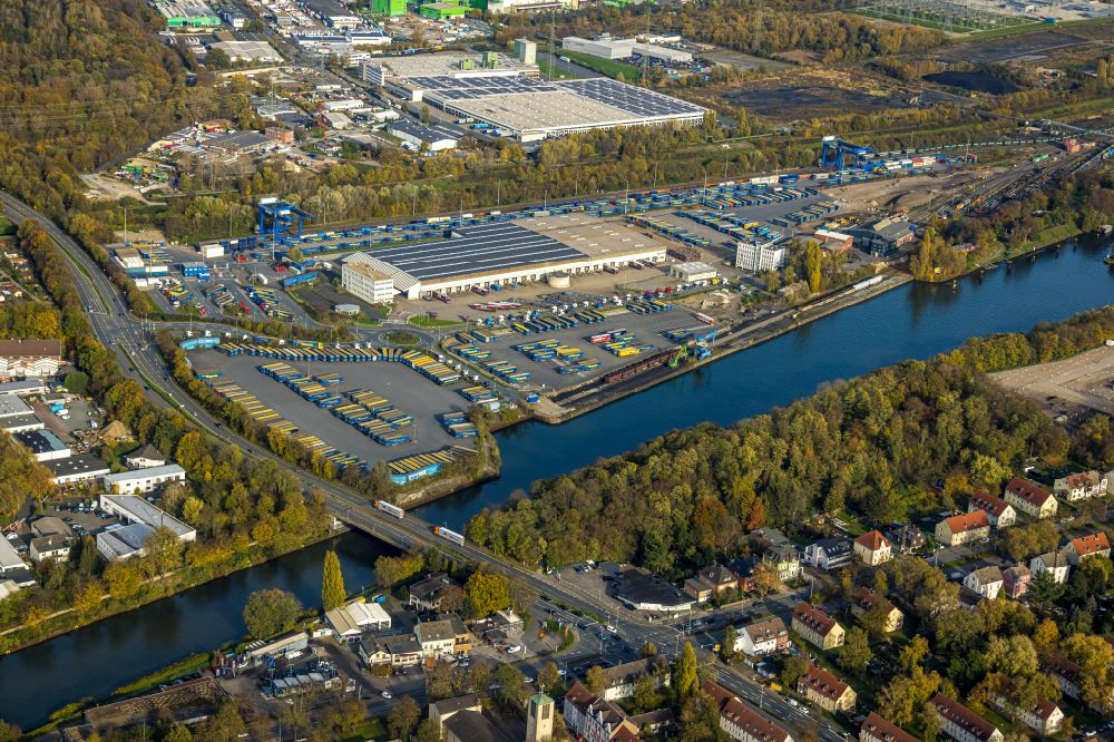 Aerial image Crange - Autumnal discolored vegetation view Forwarding building of the logistics and transport company Mueller - Die lila Logistik GmbH at the Westhafen on the Rhine-Herne Canal in Crange in the Ruhr area in the state of North Rhine-Westphalia, Germany
