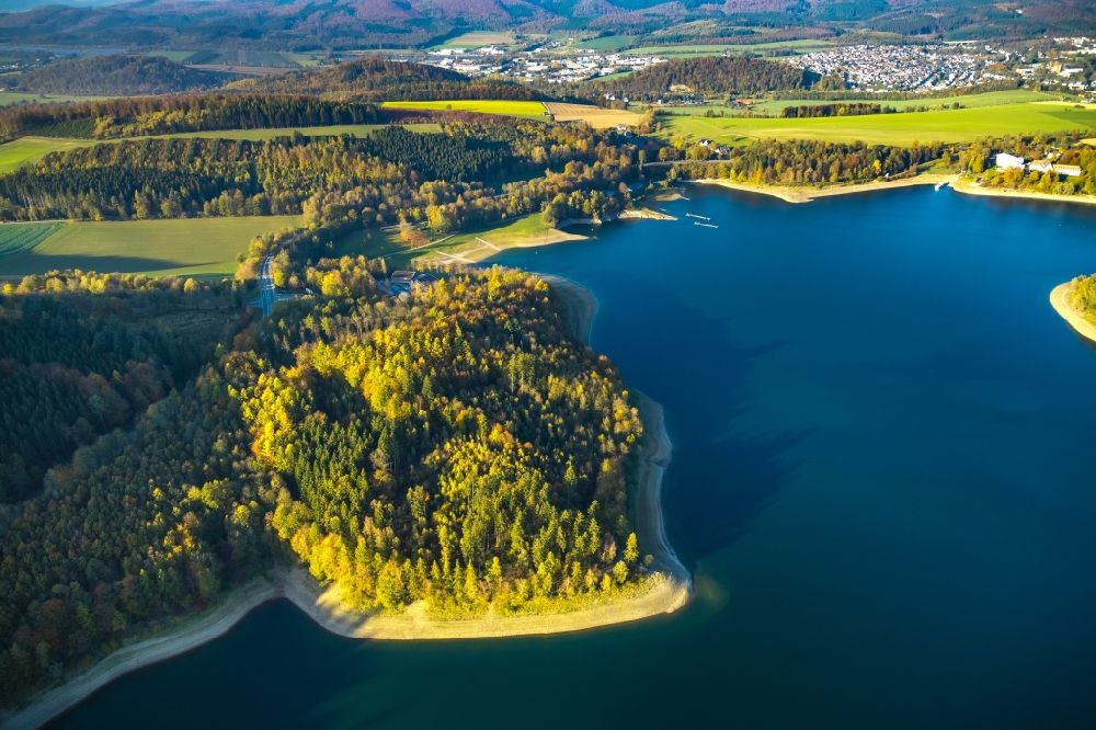 Aerial image Meschede - Autumnal discolored vegetation view impoundment and shore areas at the lake Hennesee in Meschede in the state North Rhine-Westphalia, Germany