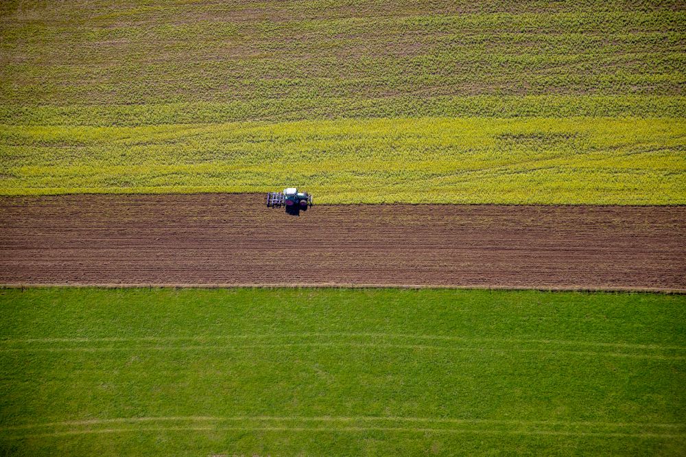 Aerial image Obringhausen - Autumnal discolored vegetation view transport vehicles in agricultural fields in Obringhausen in the state North Rhine-Westphalia, Germany