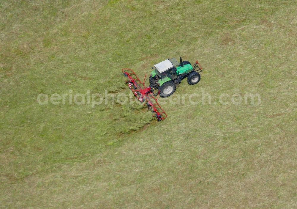 Aerial image Friedland - Tractor on agricultural fields in Friedland in the state Lower Saxony, Germany