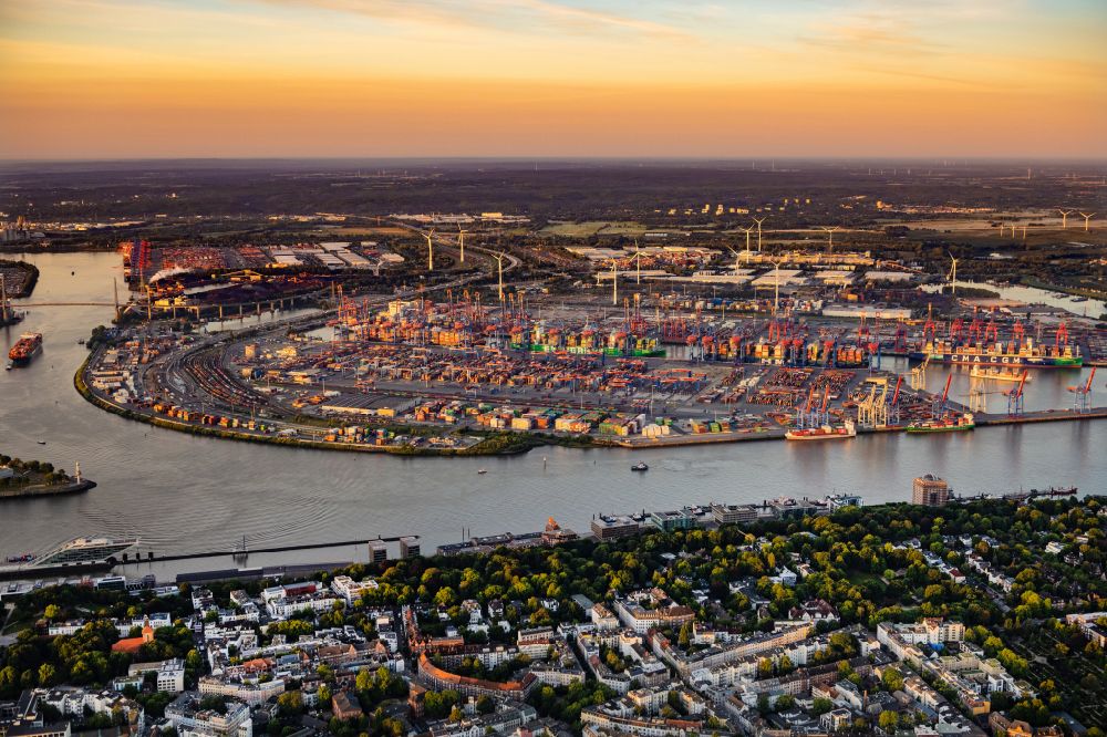 Hamburg from the bird's eye view: HHLA Logistics Container Terminal Burchardkai at the Port of Hamburg, at sunrise, in Hamburg