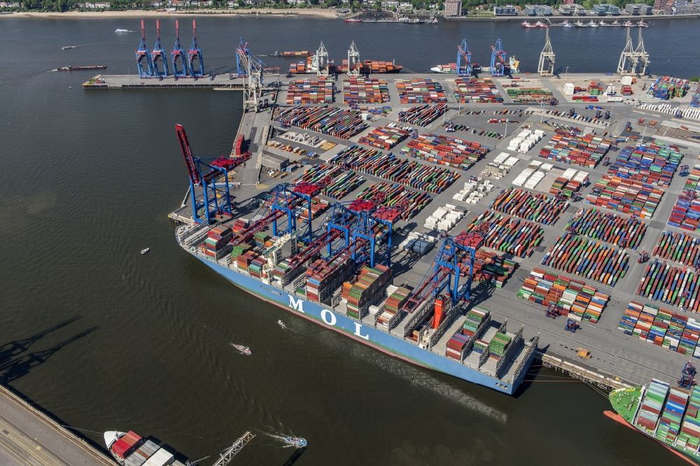 Hamburg from the bird's eye view: View on container and container ships at berth HHLA Logistics Container Terminal Burchhardkai and Walter Hofer Euro Gate Container Terminal in the Port of Hamburg harbor in Hamburg. Containership MOL Triumph