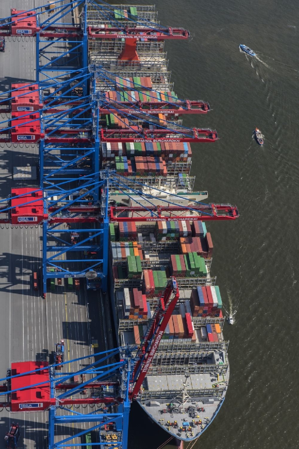 Hamburg from the bird's eye view: View on container and container ships at berth HHLA Logistics Container Terminal Burchhardkai and Walter Hofer Euro Gate Container Terminal in the Port of Hamburg harbor in Hamburg. Containership MOL Triumph