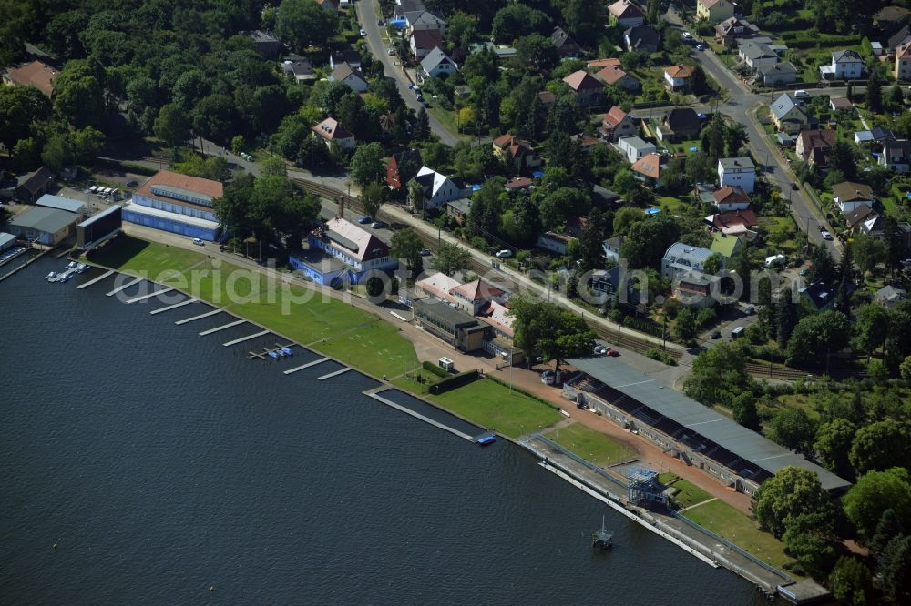 Aerial photograph Berlin - Historic buildings on the regatta course on the riverbank of the river Dahme in the Gruenau part of the district of Treptow-Koepenick in Berlin in Germany. The stands, the water sports museum and other historic buildings of sports clubs and events locations belong to the compound on the race track