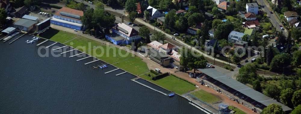 Berlin from above - Historic buildings on the regatta course on the riverbank of the river Dahme in the Gruenau part of the district of Treptow-Koepenick in Berlin in Germany. The stands, the water sports museum and other historic buildings of sports clubs and events locations belong to the compound on the race track