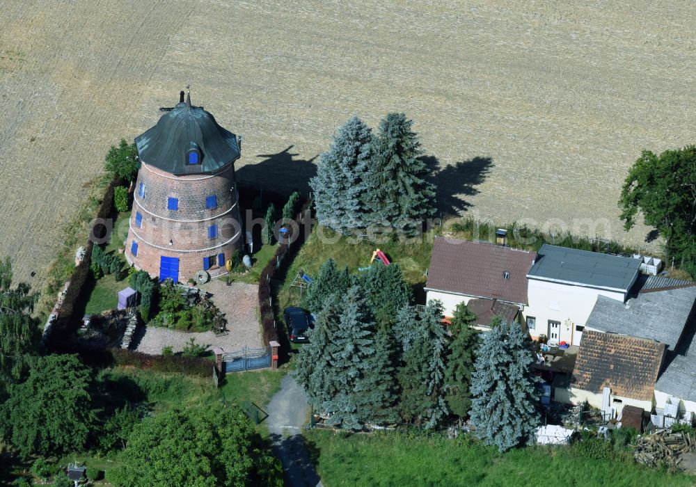 Aerial image Naundorf - Historic windmill on a farm homestead on the edge of cultivated fields in Naundorf in the state Saxony