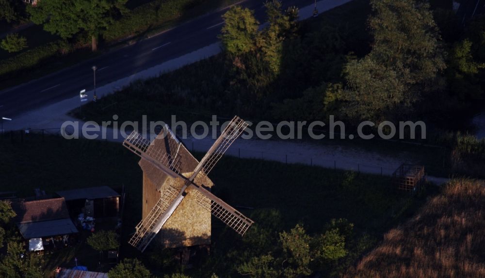 Vehlefanz from above - Historic windmill on a farm homestead on the edge of cultivated fields in Vehlefanz in the state Brandenburg