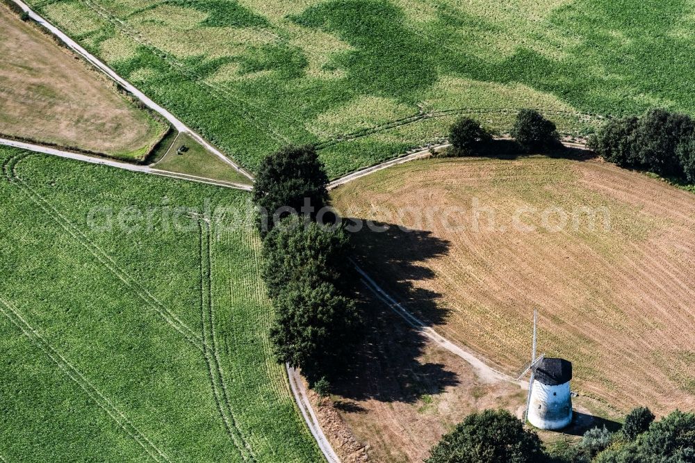 Aerial photograph Krefeld - Historic windmill on a farm homestead on the edge of cultivated fields in Krefeld in the state North Rhine-Westphalia