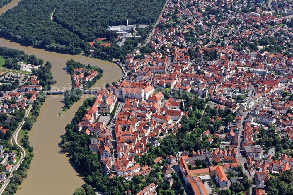 Neuburg an der Donau from above - Historic old town of Neuburg an der Donau in the state of Bavaria. The large city castle dates back to a medieval castle and now houses the Schlossmuseum. In the center town parish church of St. Peter and Hofkirche and the town hall