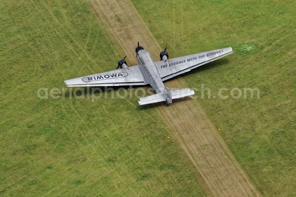 Aerial photograph Oberschleißheim - Historical aircraft Junkers 52 while taxiing on the airfield Schleissheim EDNX in Oberschleissheim in the state Bavaria, Germany