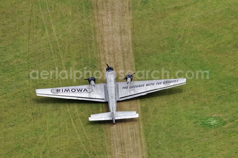 Oberschleißheim from above - Historical aircraft Junkers 52 while taxiing on the airfield Schleissheim EDNX in Oberschleissheim in the state Bavaria, Germany