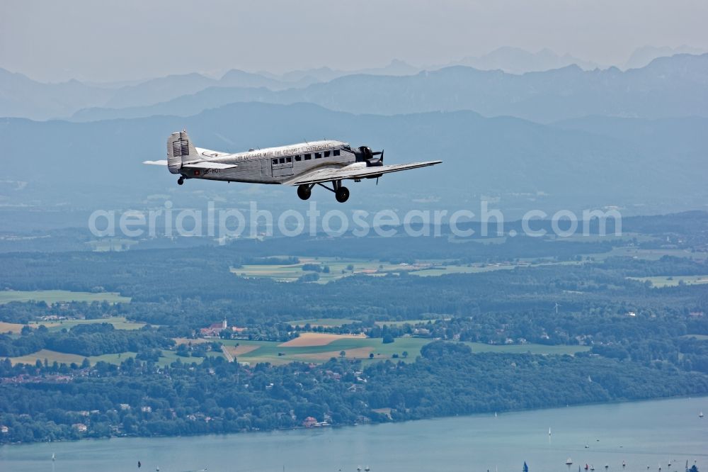 Aerial image Starnberg - Historic aircraft Junkers Ju 52 on the fly over the airspace near Starnberg in the state Bavaria, Germany