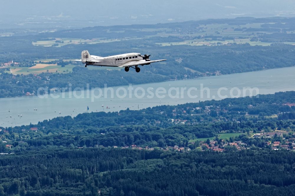Aerial image Starnberg - Historic aircraft Junkers Ju 52 on the fly over the airspace near Starnberg in the state Bavaria, Germany