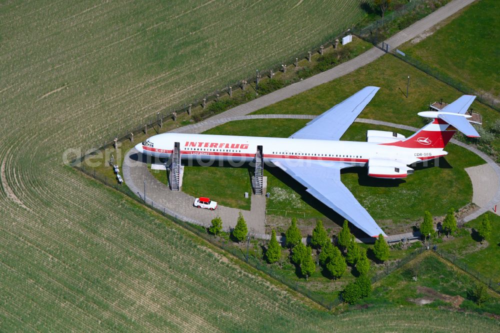 Stölln from above - Historic passenger plane IL-62 of the airline INTERFLUG Lady Agnes with the registration DDR-SEG on a parking area of the airfield in Stoelln in the state Brandenburg, Germany