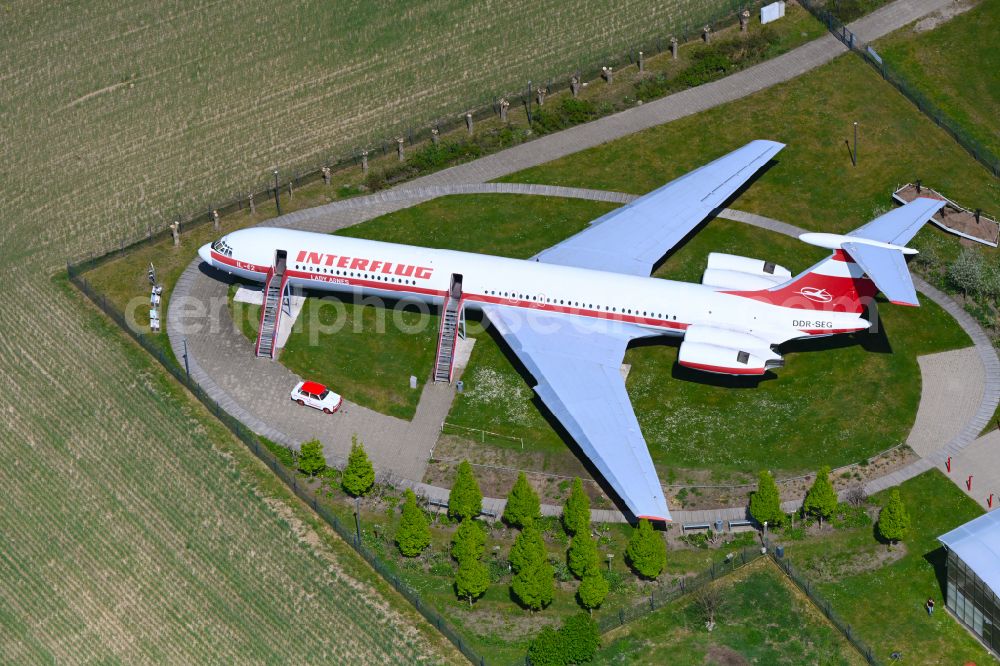 Stölln from the bird's eye view: Historic passenger plane IL-62 of the airline INTERFLUG Lady Agnes with the registration DDR-SEG on a parking area of the airfield in Stoelln in the state Brandenburg, Germany