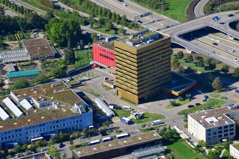 Basel from the bird's eye view: High-rise building of the hotel complex Airport Hotel Basel and Grand Casino Basel at the Flughafenstrasse in the district Sankt Johann in Basel, Switzerland. The modern houses are designed by Burckhardt and Partner