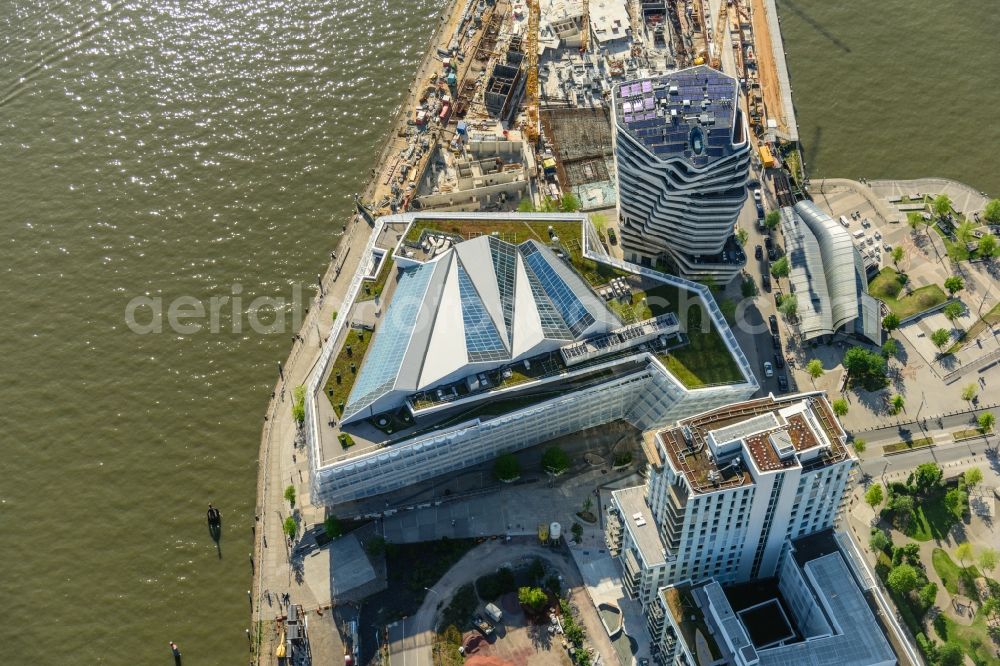 Hamburg from the bird's eye view: High-rise buildings Marco-Polo-Tower of Unilever Deutschland Holding GmbH in the district HafenCity in Hamburg, Germany