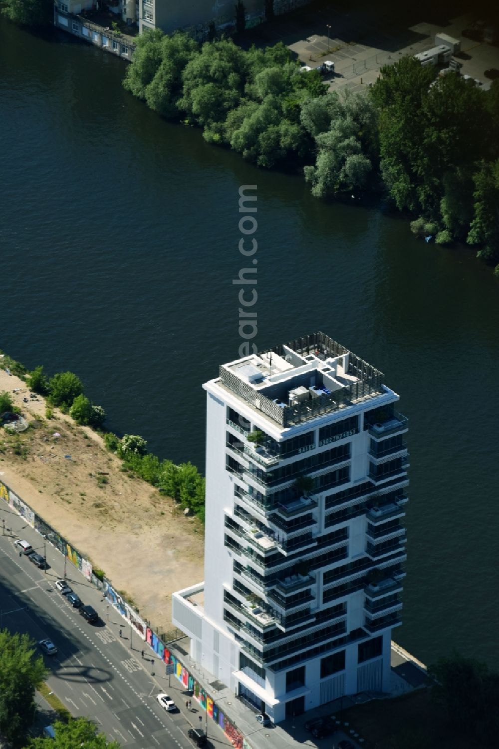 Berlin from above - Project Living Levels at Muhlenstrasse on the banks of the River Spree in Berlin - Friedrichshain. On the grounds of the Berlin Wall border strip at the EastSideGallery, the company Living Bauhaus is building a futuristic high-rise residential. The real estate service company City & Home GmbH manages the available apartments