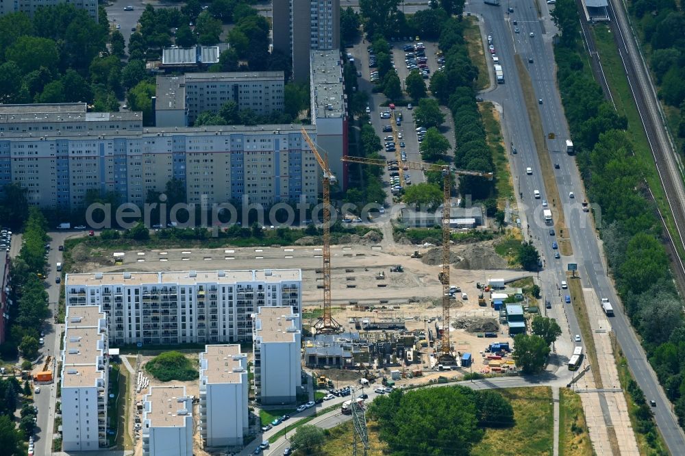 Berlin from the bird's eye view: High-rise construction site for a new residential and commercial building Wuhletaler Fenster on street Maerkischen Allee in the district Marzahn in Berlin, Germany