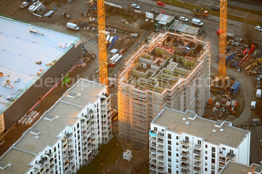 Berlin from the bird's eye view: High-rise construction site for a new residential and commercial building Wuhletaler Fenster on street Maerkischen Allee in the district Marzahn in Berlin, Germany