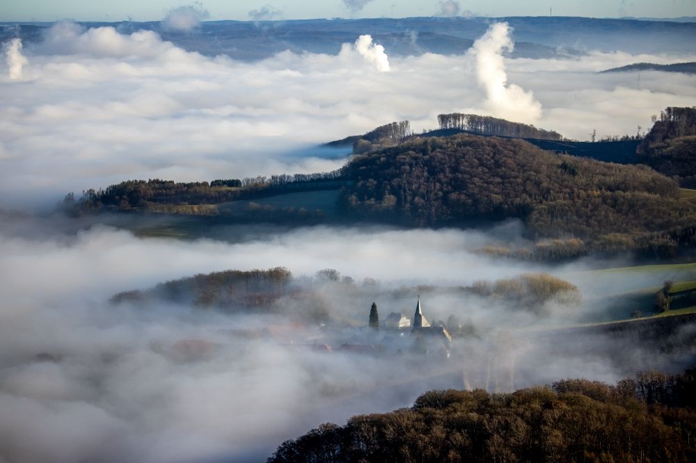Arnsberg from the bird's eye view: Layer of fog and cloud over the building complex of the Oelinghausen monastery in the district of Holzen in Arnsberg in the state of North Rhine-Westphalia