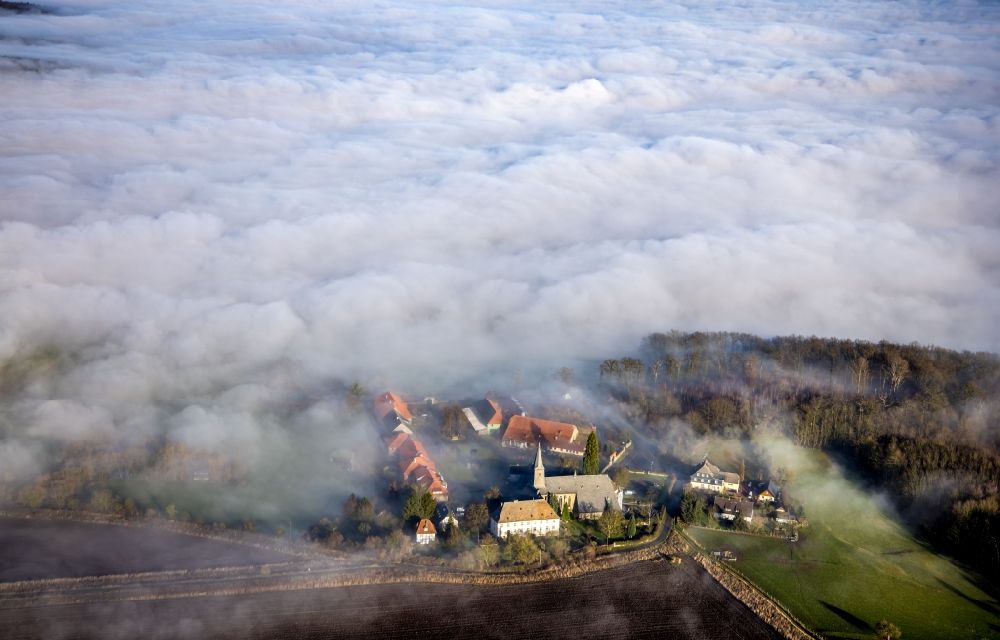 Aerial photograph Arnsberg - Layer of fog and cloud over the building complex of the Oelinghausen monastery in the district of Holzen in Arnsberg in the state of North Rhine-Westphalia