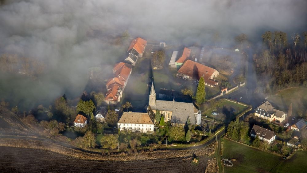 Arnsberg from above - Layer of fog and cloud over the building complex of the Oelinghausen monastery in the district of Holzen in Arnsberg in the state of North Rhine-Westphalia