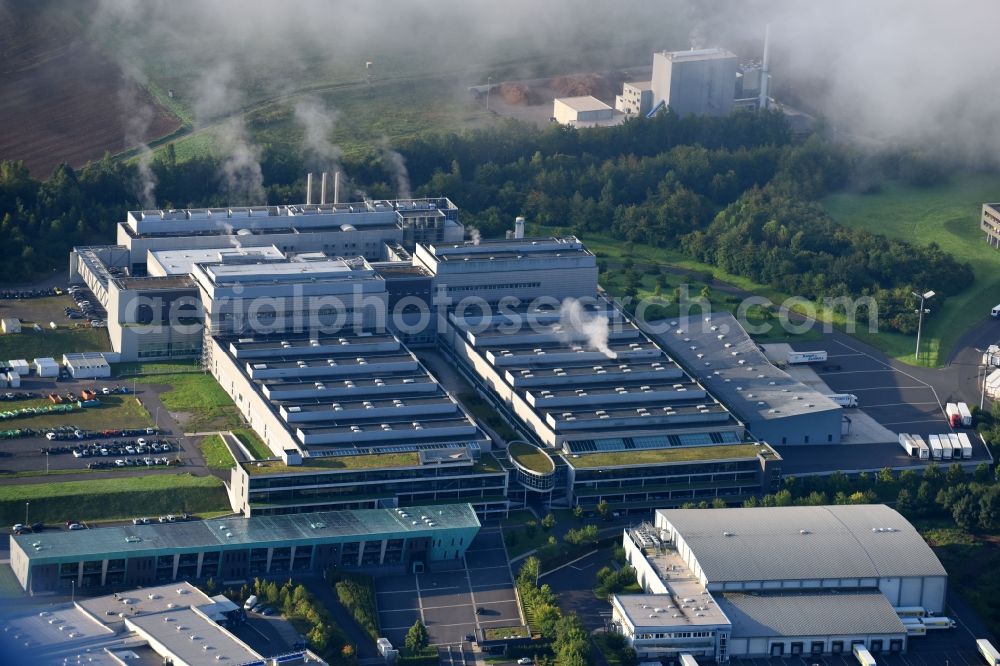 Melsungen from the bird's eye view: High-bay warehouse building complex and logistics center on the premises of EDEKA Handelsgesellschaft Hessenring GmbH in Melsungen in the state Hesse, Germany
