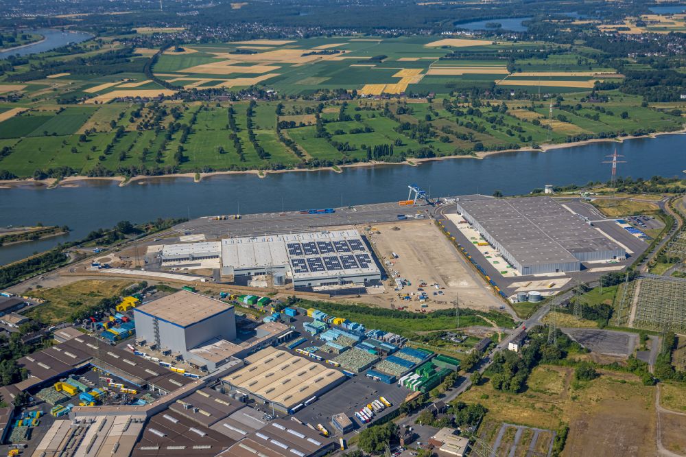 Duisburg from the bird's eye view: High-bay warehouse building complex and logistics center on the premises of logport VI on Rheinstrasse - Faehrstrasse in the district Alt-Walsum in Duisburg at Ruhrgebiet in the state North Rhine-Westphalia, Germany