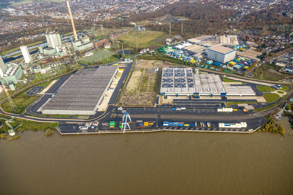 Duisburg from the bird's eye view: High-bay warehouse building complex and logistics center on the premises of logport VI on the river Rhine on Rheinstrasse - Faehrstrasse in the district Alt-Walsum in Duisburg at Ruhrgebiet in the state North Rhine-Westphalia, Germany