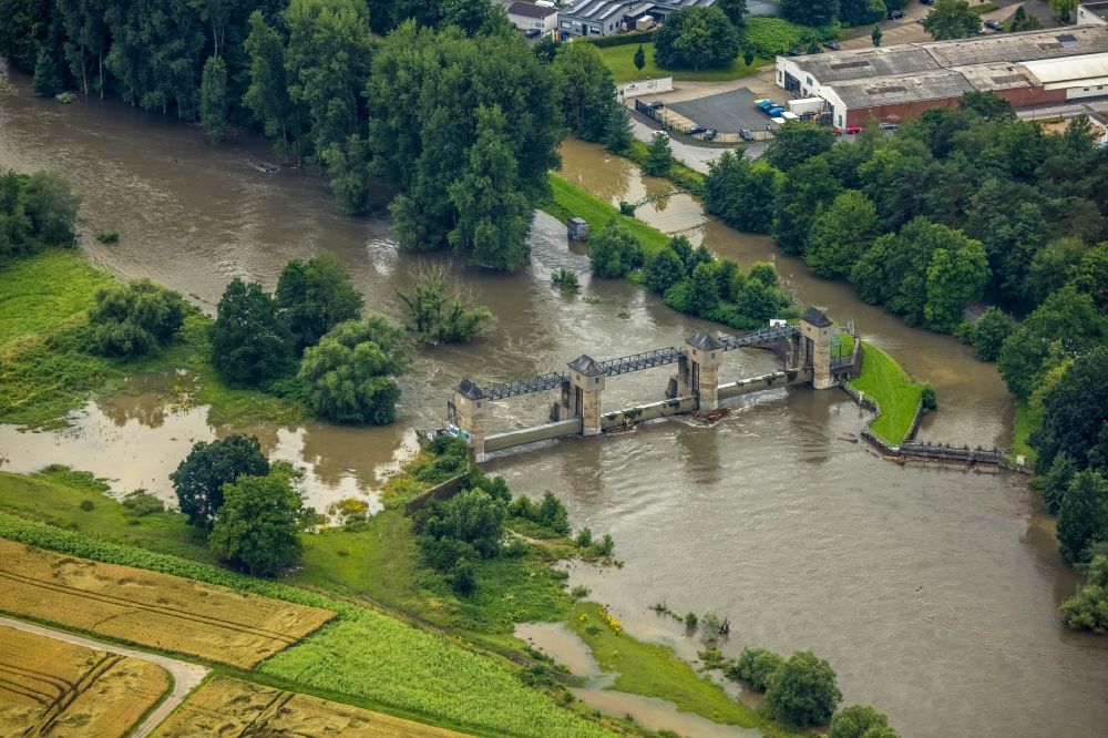 Wickede (Ruhr) from the bird's eye view: Flood on the hydroelectric power plant on the river Ruhr in Wickede (Ruhr) in the state of North Rhine-Westphalia, Germany