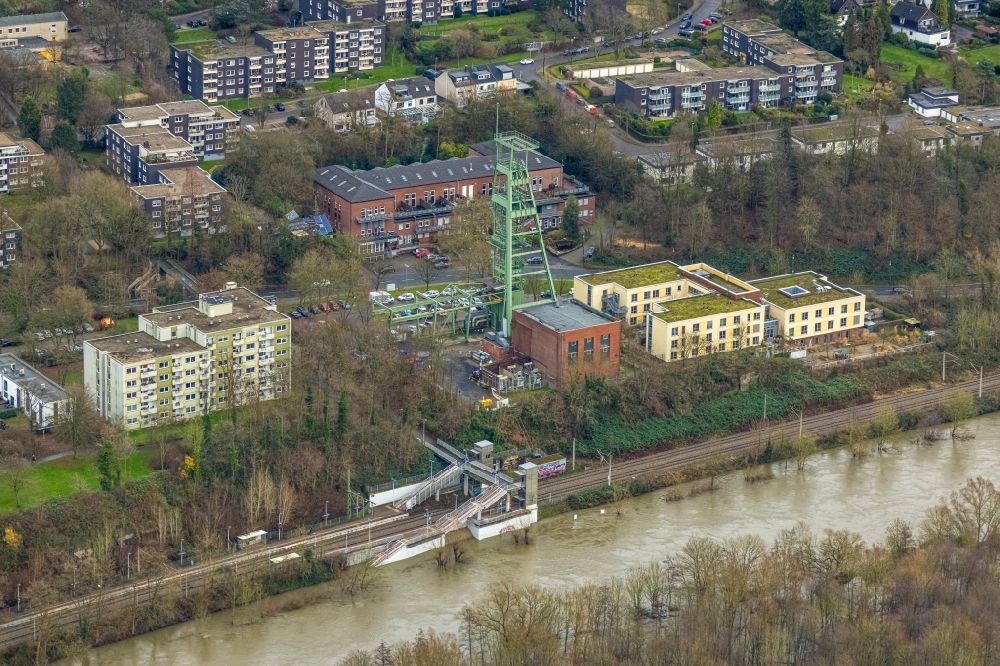 Aerial photograph Essen - Flood situation and flooding, all-rousing and infrastructure-destroying masses of brown water on Bahnhof Holthausen in the district Ueberruhr - Holthausen in Essen at Ruhrgebiet in the state North Rhine-Westphalia, Germany